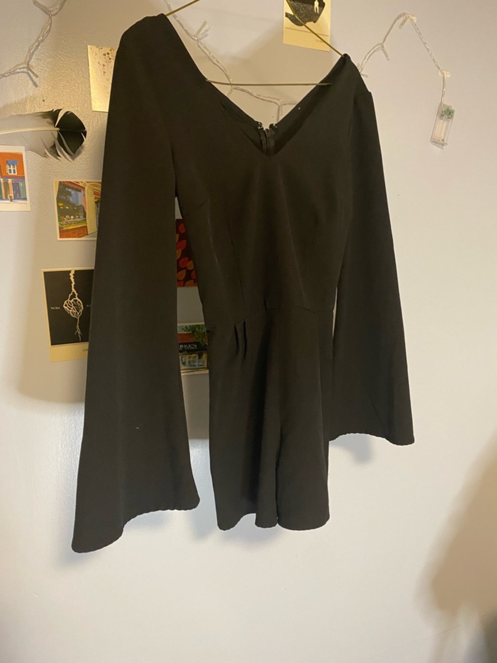 Black V-Neck Long Sleeve Peplum Romper. flared sleeves